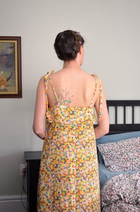 Woman wearing a long floral nightgown