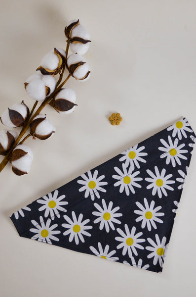 Black bandana with white daisy pattern on a light background