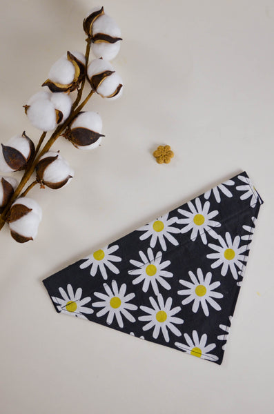 Black bandana with white daisy pattern on a light background